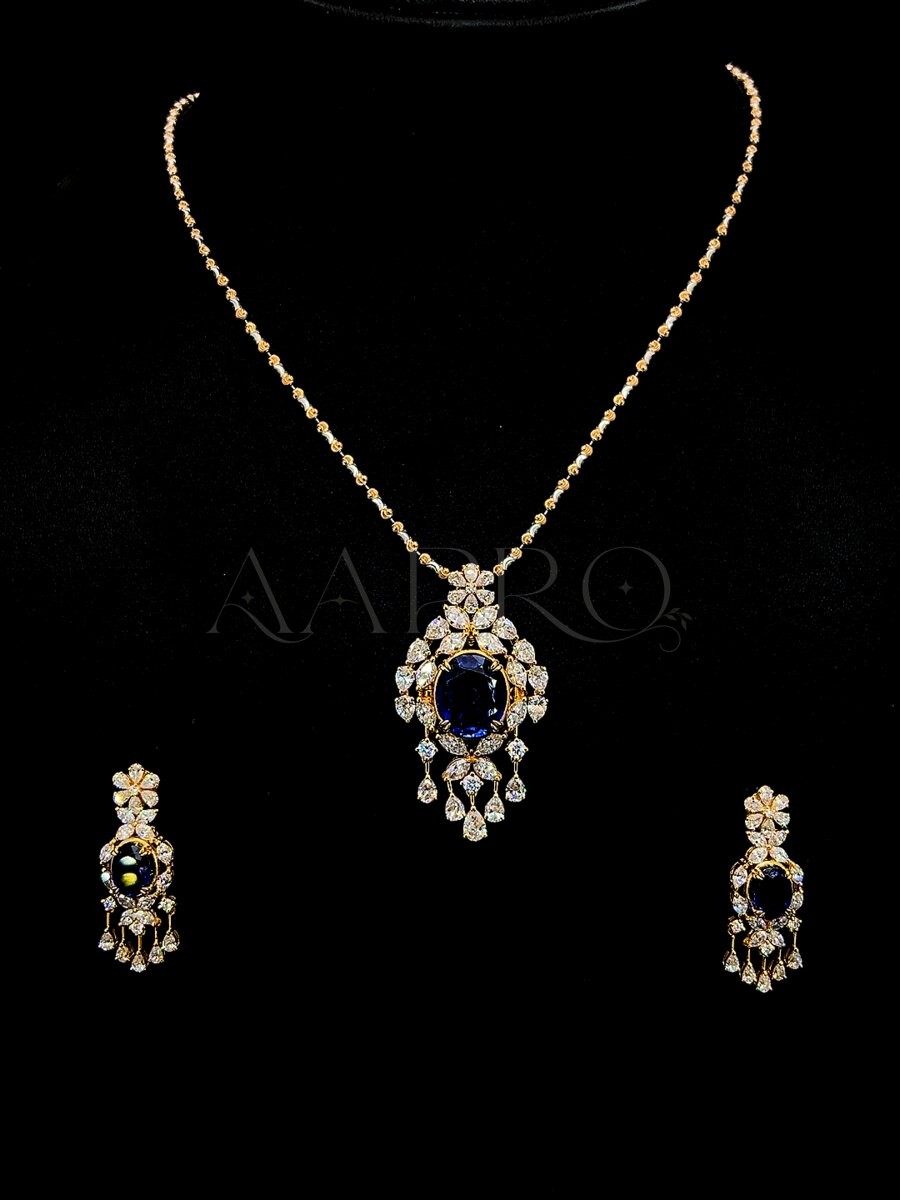 Sapphire and diamond pendant necklace with matching drop earrings