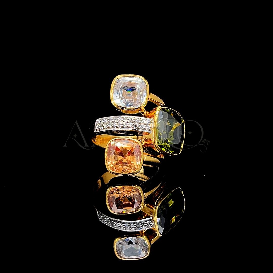 Stacked cushion-cut gemstone rings in white, peridot and champagne tones with a pave band